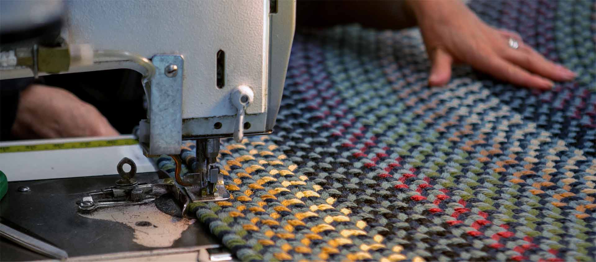 Braided Rugs being sewn on machine